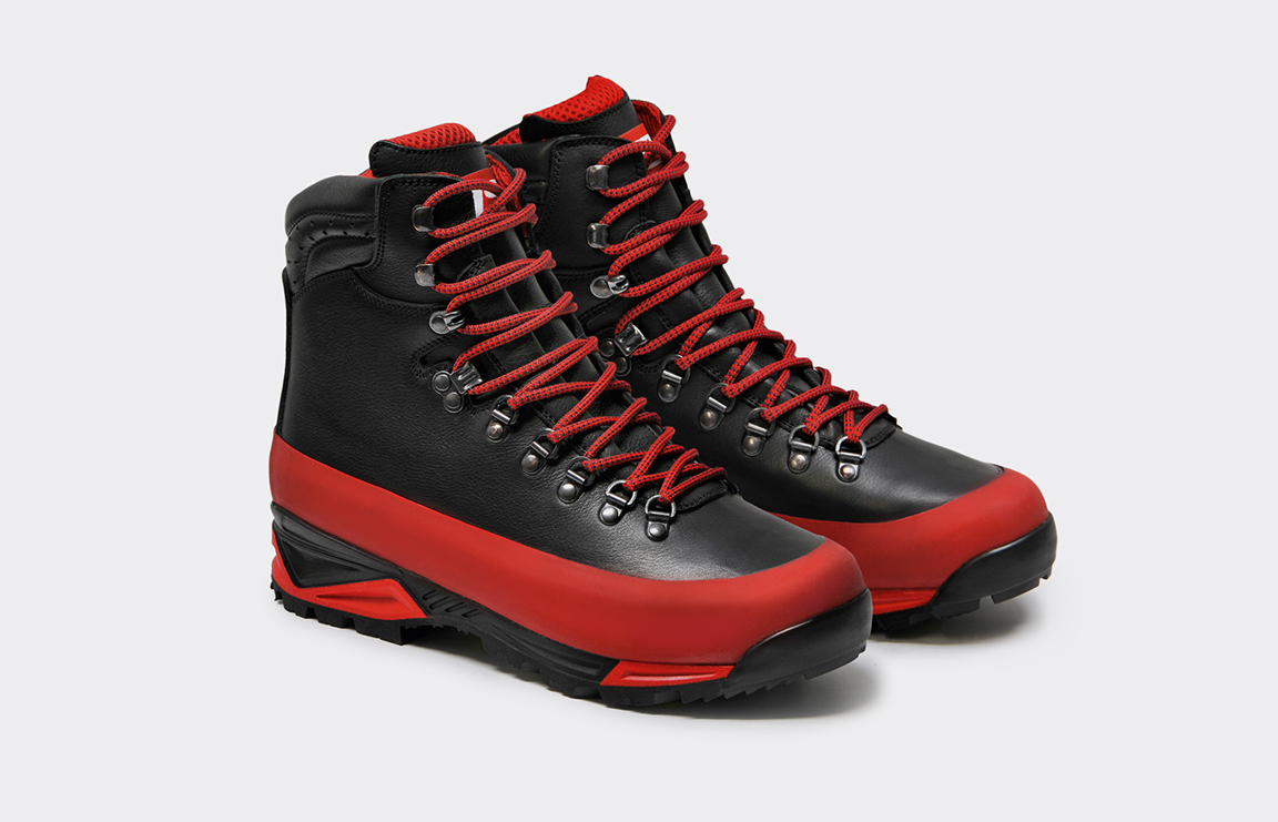 Pair of black leather trekking boots with red Gripp bands and red laces