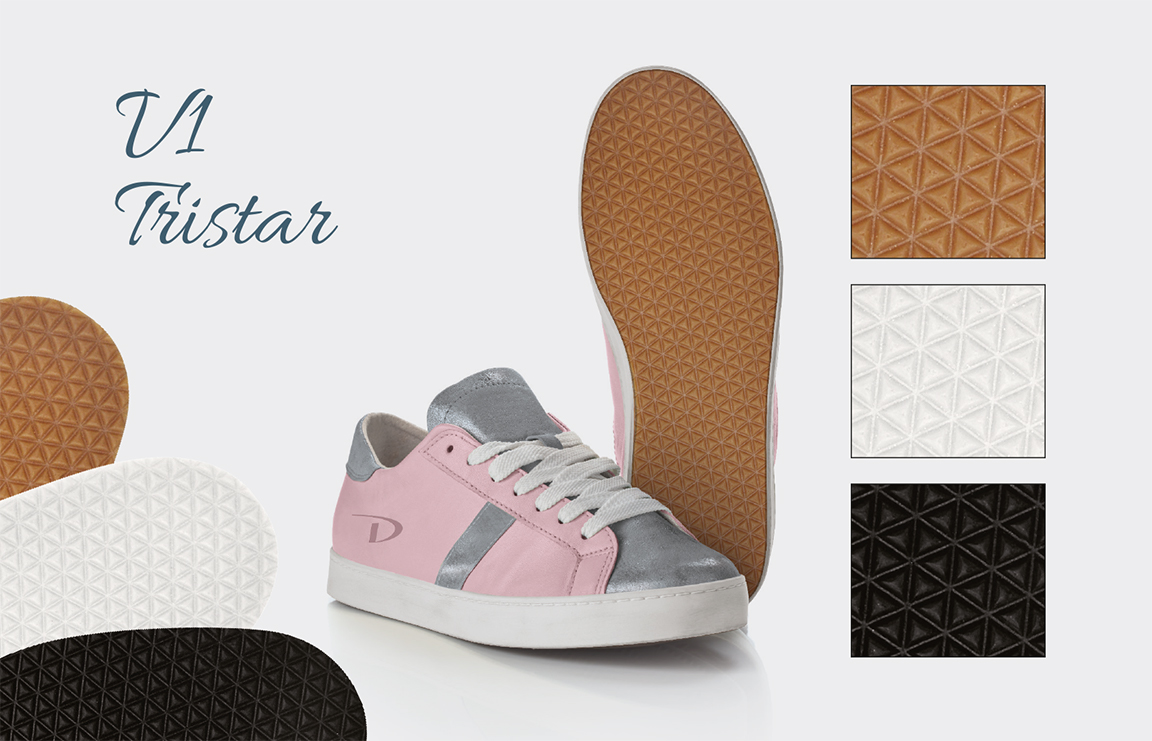 V1 Tristar board with a pink sneaker and triangular-lattice tread in gum, white and black