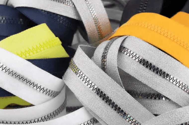MAM moulded and metal zipper tapes in white, grey, navy, yellow and lime