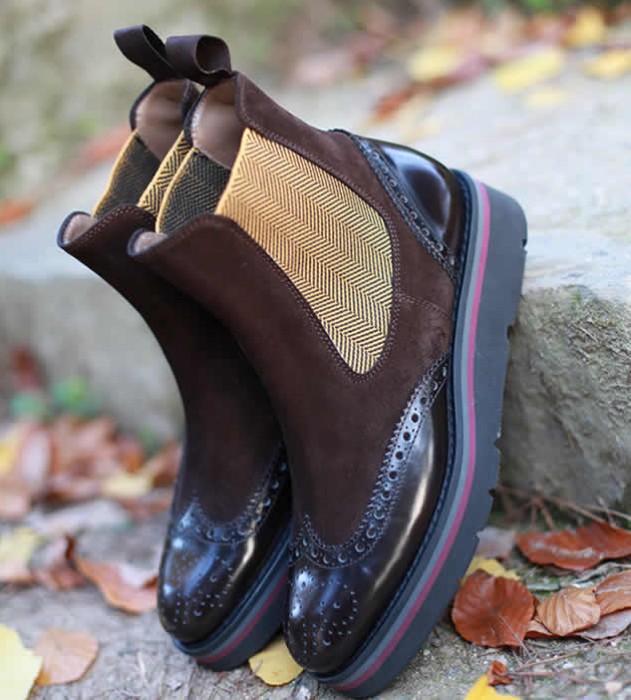 Brown suede Chelsea boots with a gold herringbone side elastic